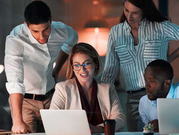 Four people working together.